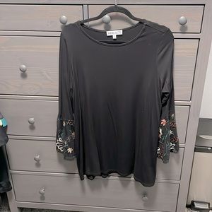 Black shirt with lacy bellbottom sleeves